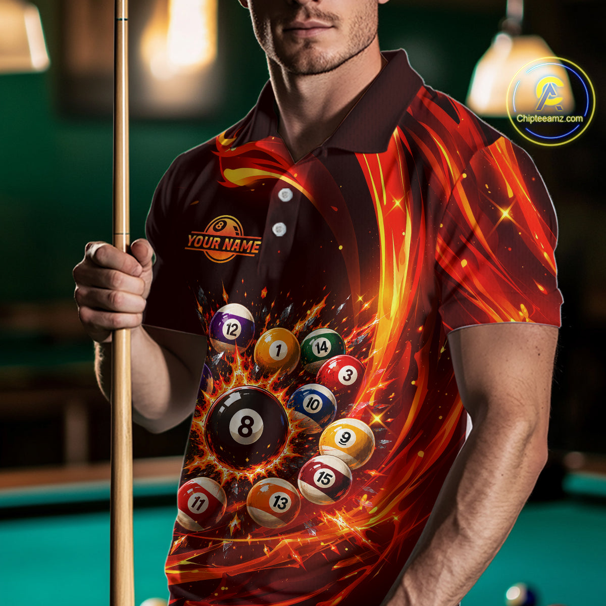 Person wearing a shirt with pool ball design holding a pool cue, with a pool table in the background.