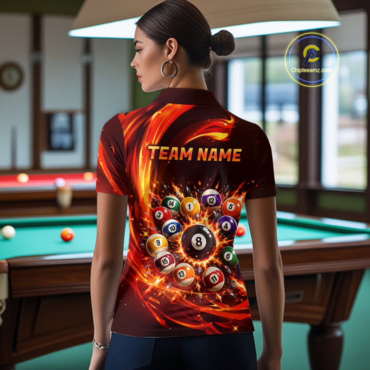 Person wearing a shirt with billiard ball design and 'Team Name' text in a pool hall.