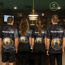 Load image into Gallery viewer, Four people standing with their backs facing the camera in a billiards hall, wearing matching black polo shirts with shattered-glass graphics, “TEAM NAME” text, and large yellow 9-ball designs on the back.