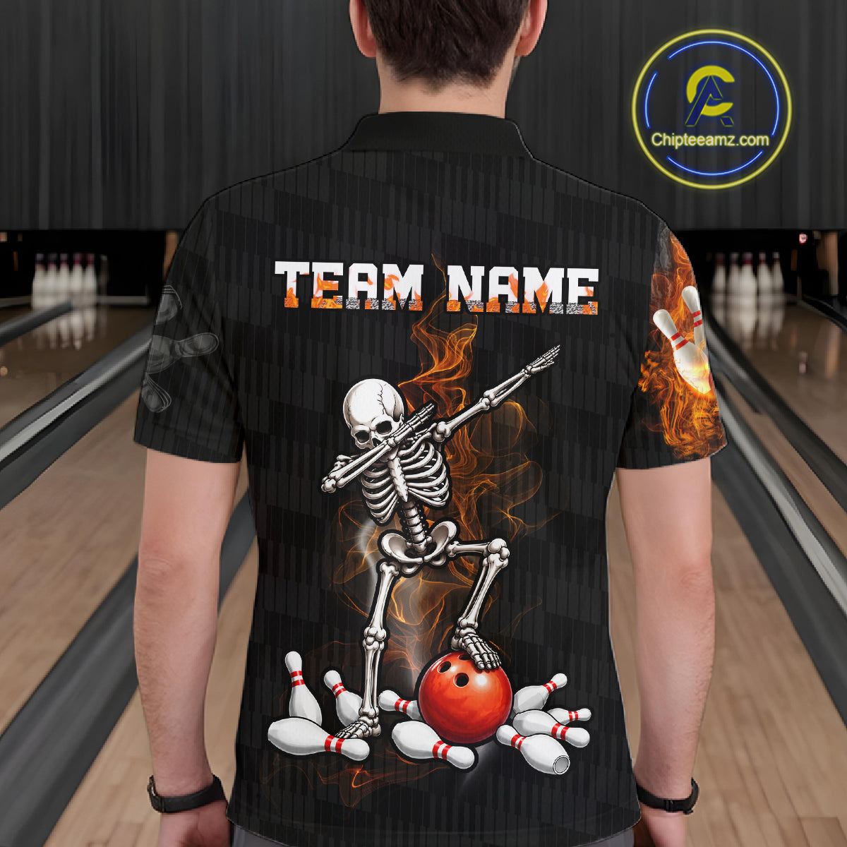 A person viewed from behind wearing a black short-sleeve bowling-themed graphic shirt with a skeleton dancing on bowling pins and a red bowling ball, set in a bowling alley. A circular 'Chipteeamz.