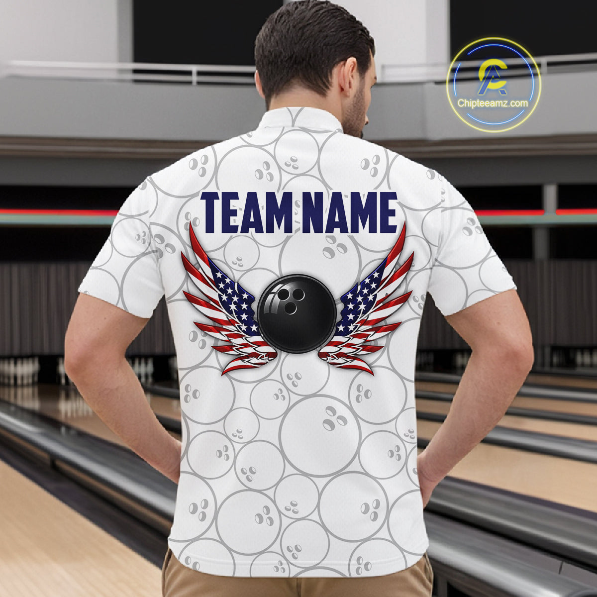 A man viewed from behind wearing a white bowling-themed short-sleeve shirt with a repeating bowling ball pattern, a large black bowling ball graphic, and red, white, and blue wings above it. The back of the shirt reads 'TEAM NAME' in navy text.
