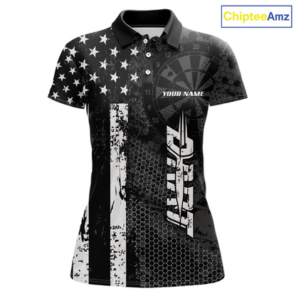 Front darts polo shirt featuring dartboard patterns layered with american flag graphics and geometric details on a black background.