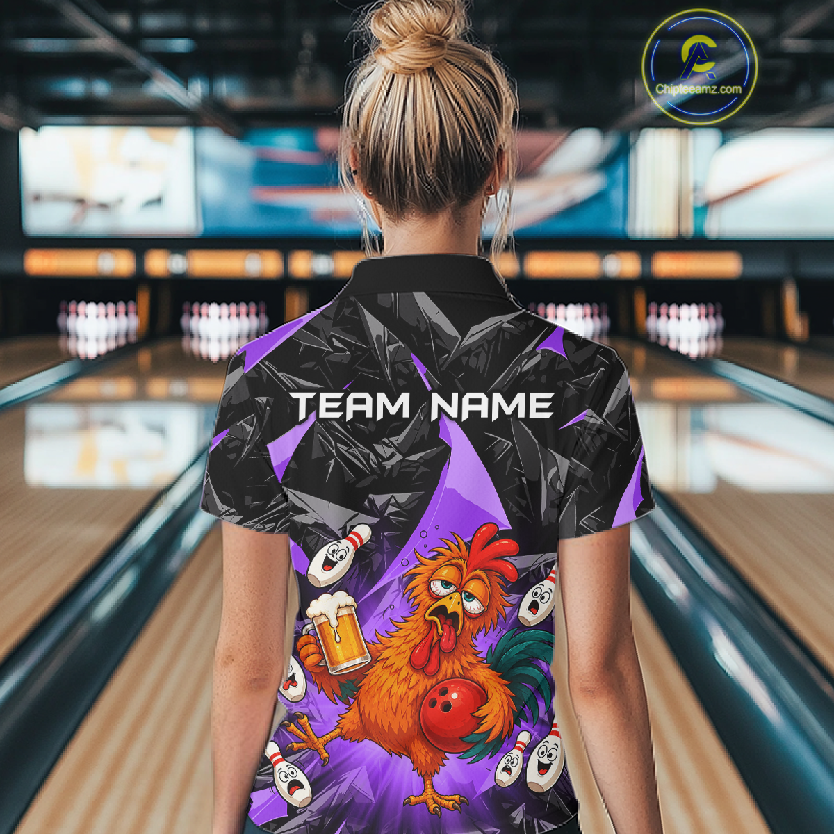 Woman wearing a black and purple bowling quarter zip featuring a wild rooster mascot holding a beer mug and red bowling ball, with custom team name text.