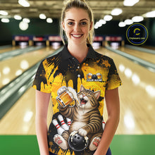 Load image into Gallery viewer, Woman wearing a colorful bowling-themed shirt with a cat design in a bowling alley.