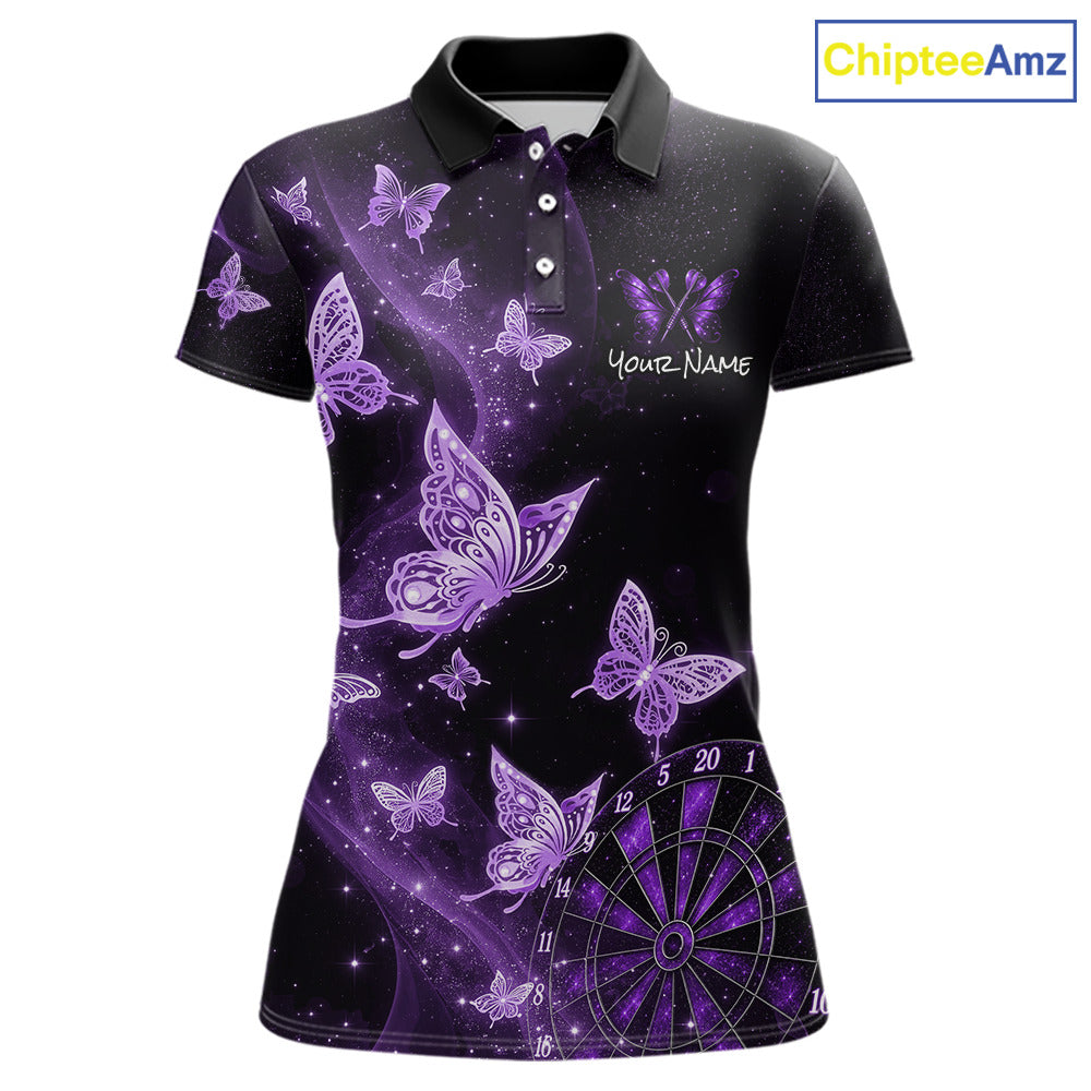 A women's short-sleeve polo shirt with a black base and a purple graphic print featuring butterflies, stars, and a dartboard. The shirt has a white script text placeholder on the chest that reads 'Your Name'.
