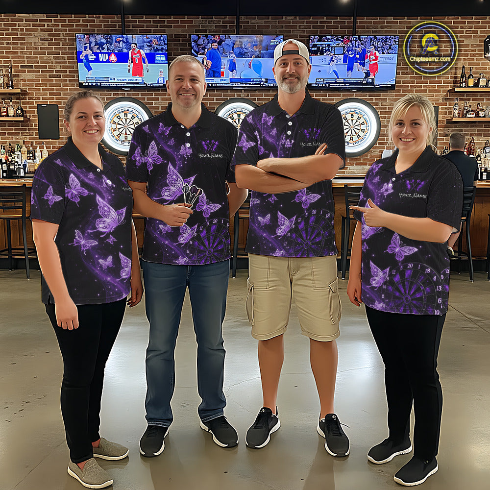 Four people standing together in a bar wearing matching black polo shirts with a purple butterfly pattern. 