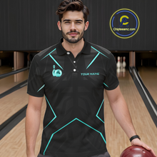Load image into Gallery viewer, Man wearing a black bowling shirt with teal accents on a bowling alley.