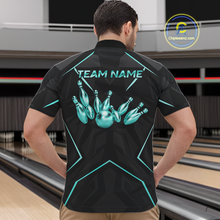 Load image into Gallery viewer, Person wearing a black bowling shirt with teal design and 'Team Name' text in a bowling alley.