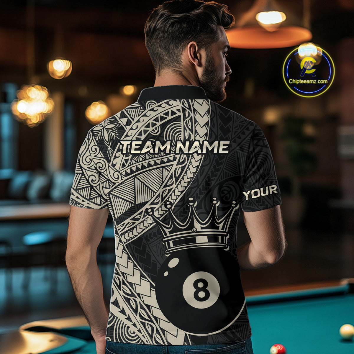 Back view of a man wearing a black and  gold polo shirt with intricate Polynesian-inspired tribal patterns, custom “TEAM NAME” text across the shoulders, and a crowned 8-ball graphic on the lower back.