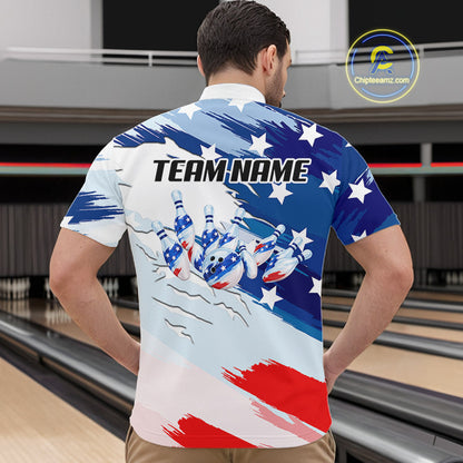 A man viewed from behind wearing a short-sleeve bowling shirt with a patriotic red, white, and blue design featuring bowling pins and the text 'TEAM NAME'. The background shows bowling lanes.