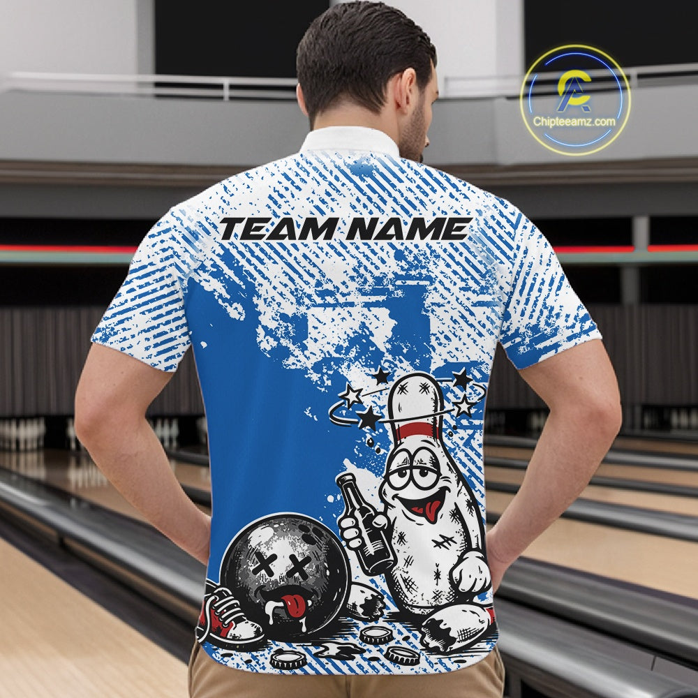 Male model at a bowling lane wearing a blue and white quarter-zip shirt, cartoon drunk bowling pin graphic with beer bottle and bowling ball.