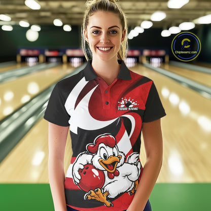 A woman stands in a bowling alley wearing a custom printed bowling-themed polo shirt. The shirt features a cartoon rooster holding a red bowling ball, a red and black striped pattern, and a white swoosh design.