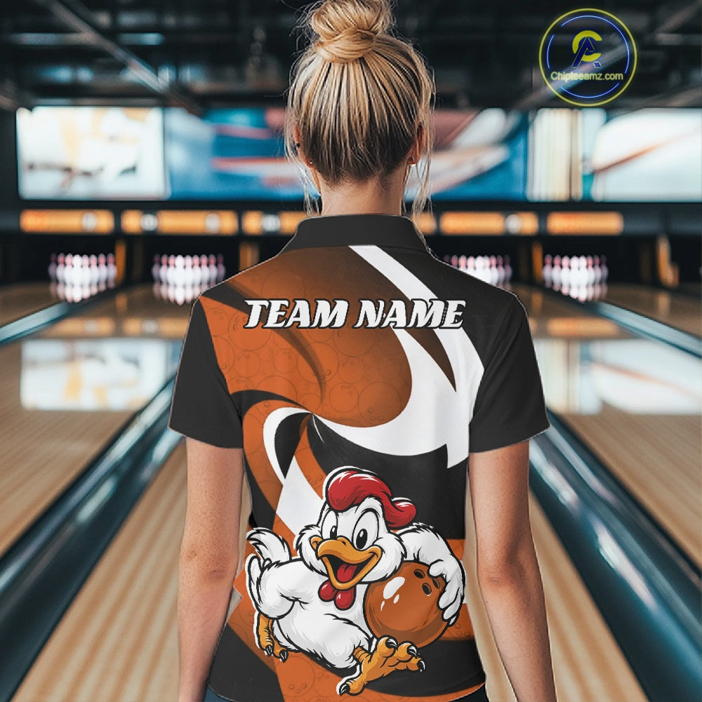 A woman viewed from behind wearing a custom bowling-themed polo shirt with a cartoon chicken graphic and 'TEAM NAME' text, set against a blurred bowling alley background.