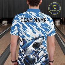 Load image into Gallery viewer, Person wearing a blue and white shirt with a shark design and 'TEAM NAME' text at a bowling alley.