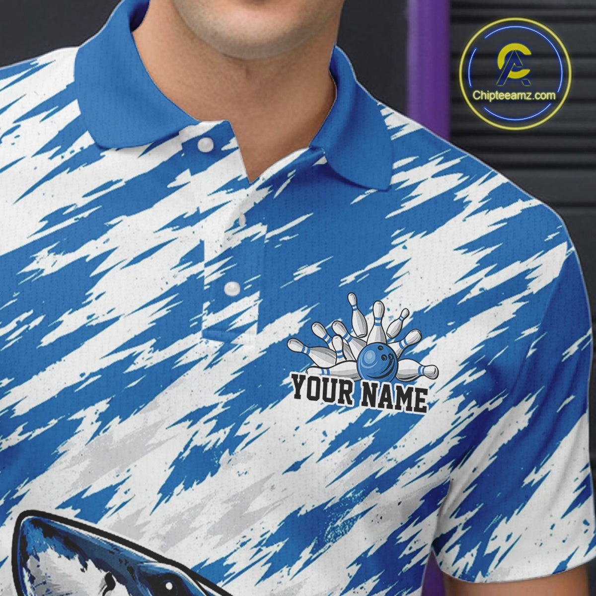 Blue and white patterned polo shirt with bowling design and 'Your Name' text, brand logo visible.