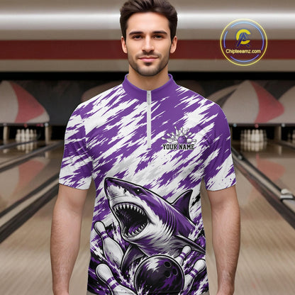 Man wearing a purple and white bowling shirt with shark design in a bowling alley.