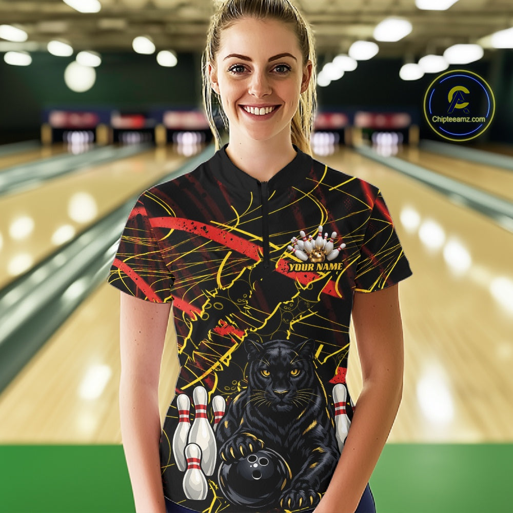 A woman wearing a custom bowling-themed short-sleeve polo shirt with a black background, yellow and red abstract lines, a black panther graphic, bowling pins, and a bowling ball. The shirt has a placeholder name on the chest.