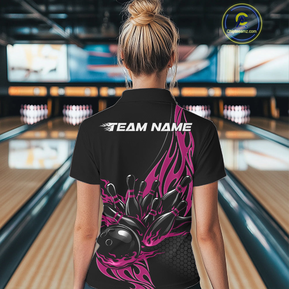 Female model back view in a bowling lane wearing a black polo shirt featuring a pink flaming black bowling ball striking pins in a vivid sports illustration.
