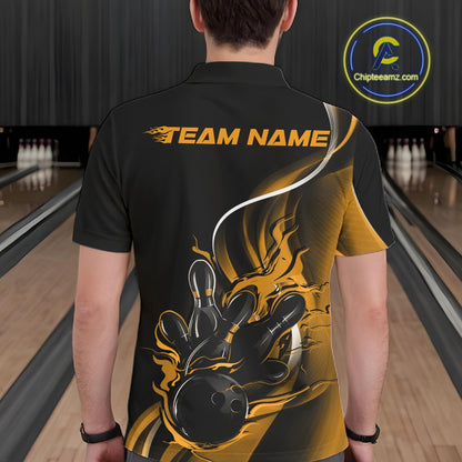 Male model seen from the back in a bowling lane wearing a black and yellow polo shirt featuring a flame bowling ball striking pins in a powerful motion design.