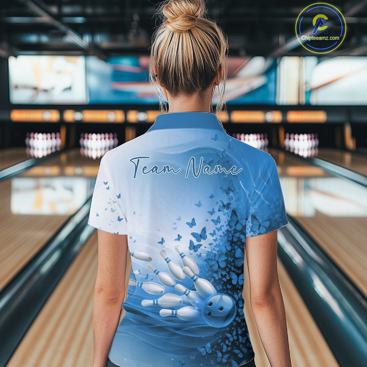 Person wearing a bowling shirt with 'Team Name' on the back in a bowling alley.