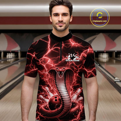 Male model in a bowling lane wearing a quarter-zip with red cobra artwork and a lightning background.