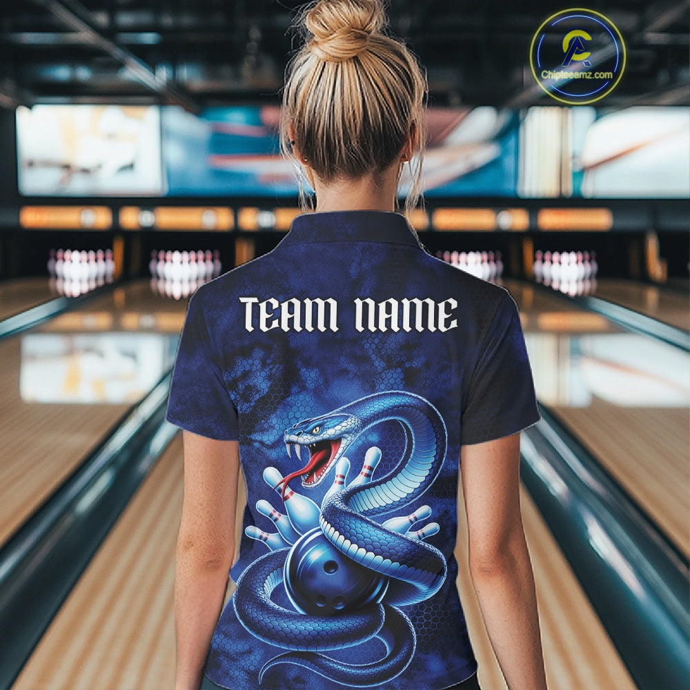 Back view of a womens bowling quarter-zip showcasing a blue cobra, bowling ball, and scattered pin graphics in a dark fantasy theme.