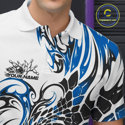 Close-up of the left chest on a white bowling polo shirt featuring blue and black tribal motifs, scale-inspired textures, and bowling-themed artwork