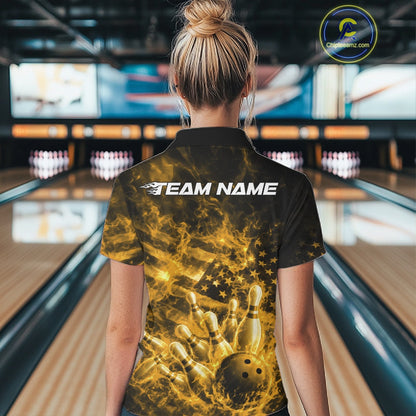 Back view of a black and yellow bowling quarter-zip displaying a flaming bowling strike illustration.