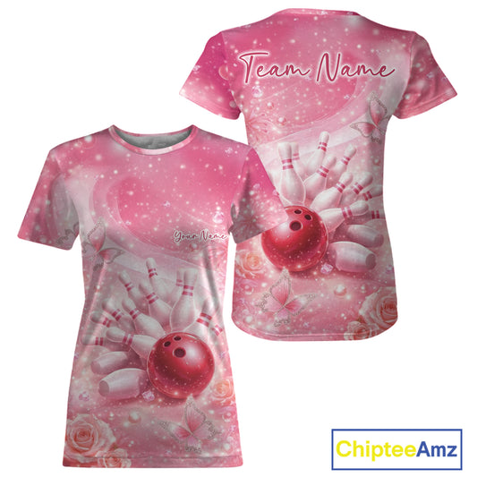 Front and back view of a women’s crewneck bowling T-shirt featuring a pink bowling ball striking pins with butterflies and sparkling diamond accents.