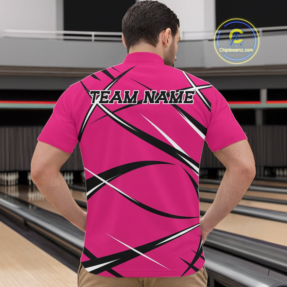 Front view of a male bowler in a bowling alley wearing a pink, black, and white bowling quarter zip shirt with an athletic jersey pattern