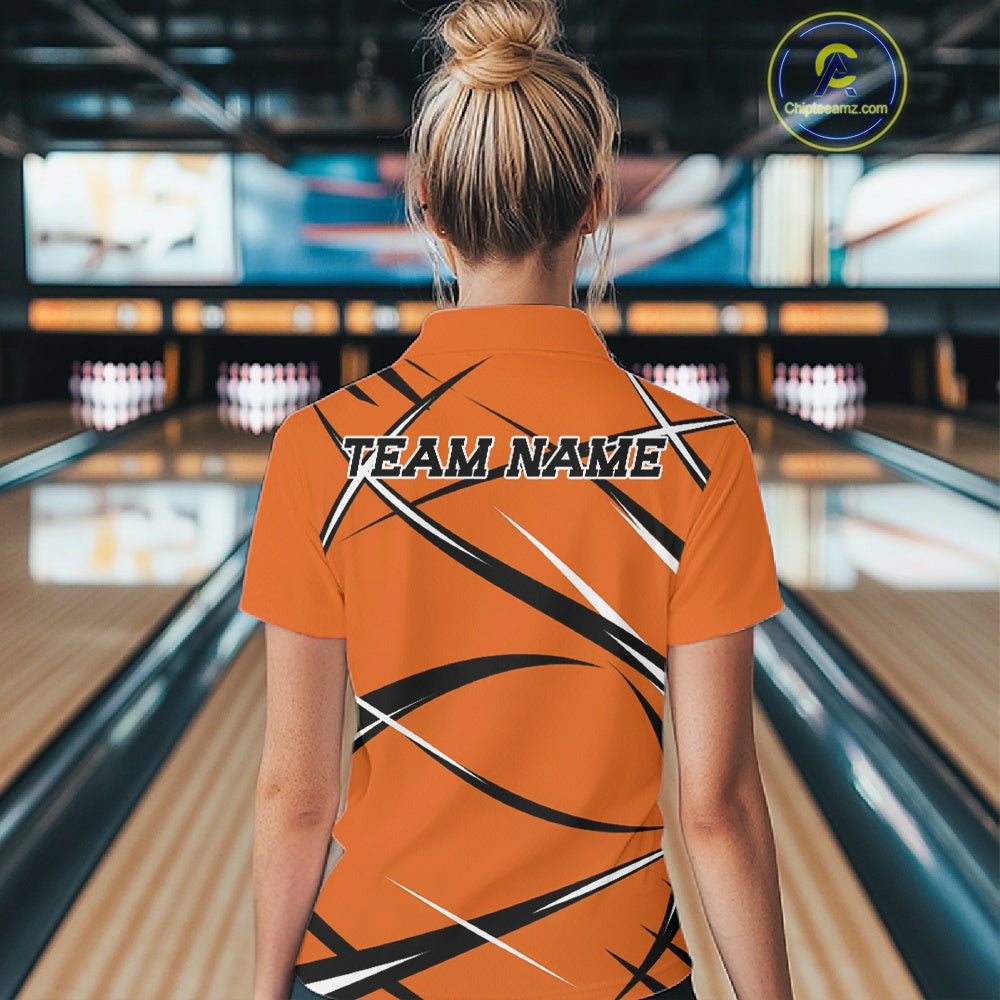 Back view of a female model in a bowling alley wearing an orange, black, and white bowling quarter zip shirt with a sporty jersey design