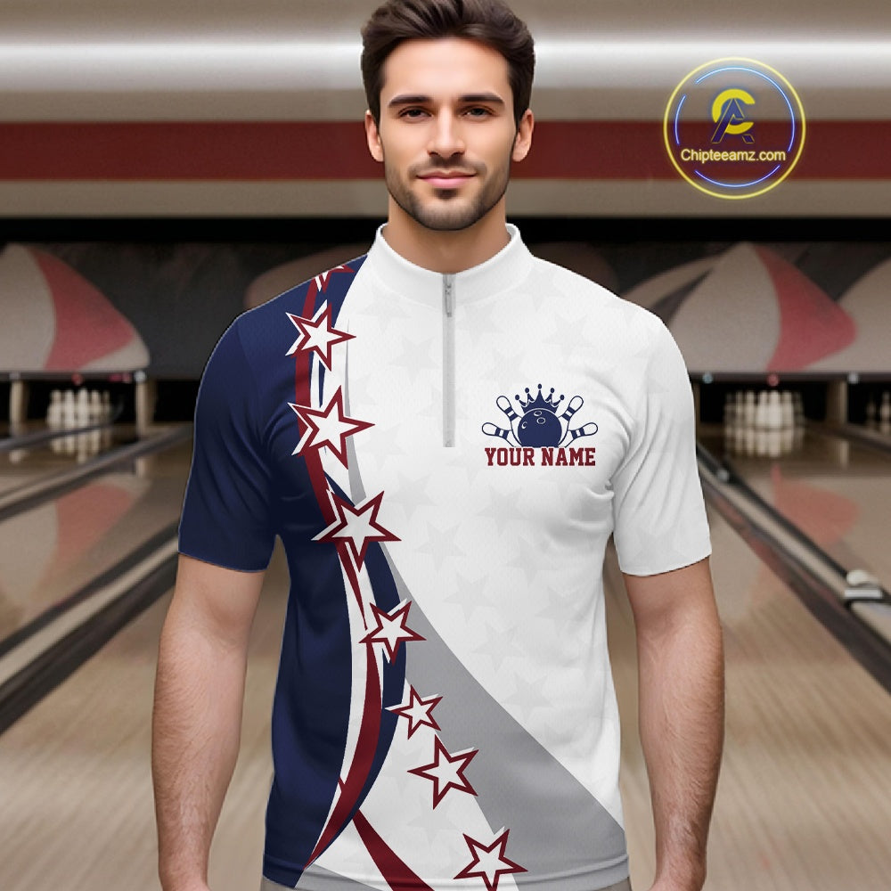 Male model front view at the bowling lane wearing a red, white, and blue bowling quarter zip shirt with sweeping stars and stripes.