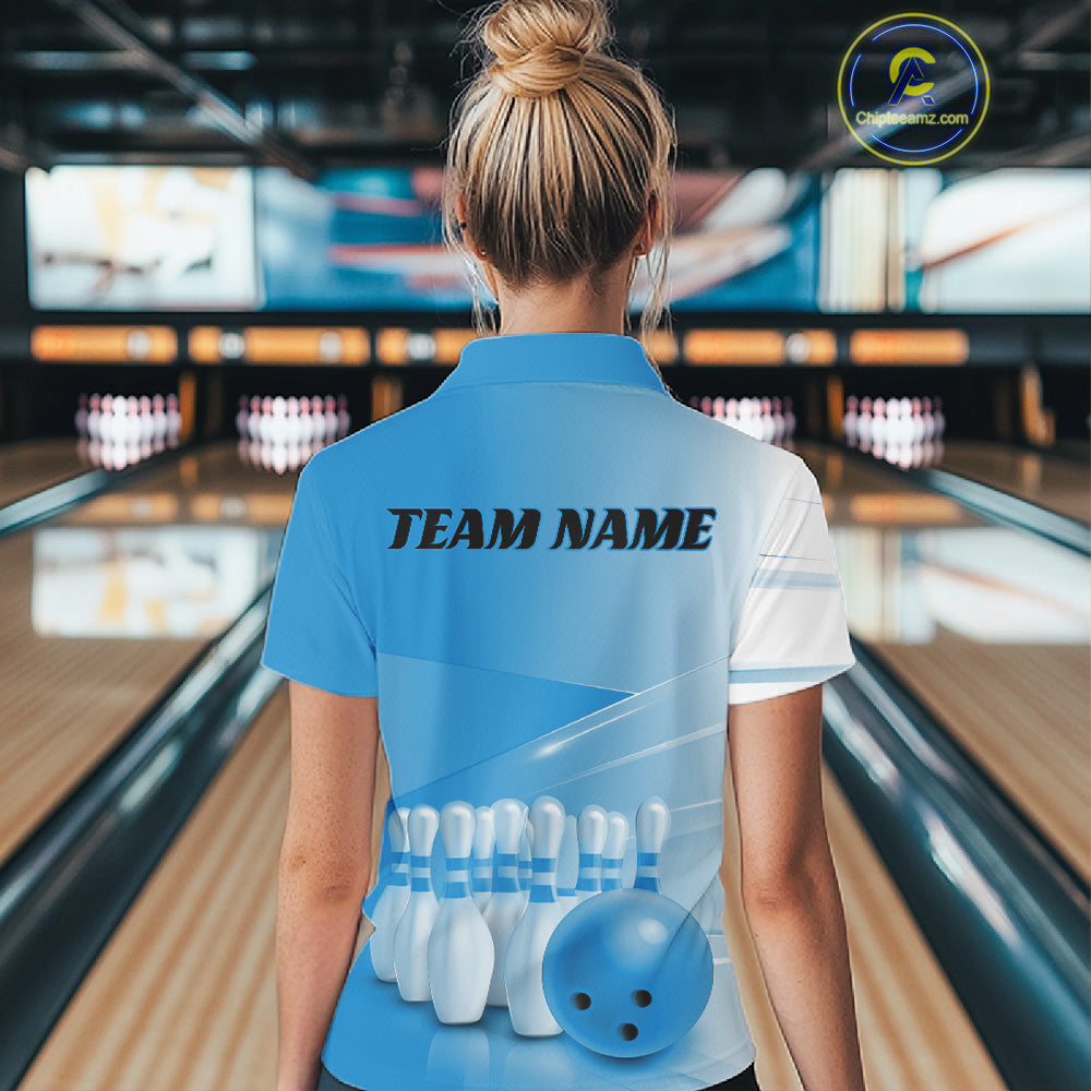 Back view of a female model in a bowling lane wearing a quarter zip shirt with bowling ball and pins arranged in a pink gradient pattern.
