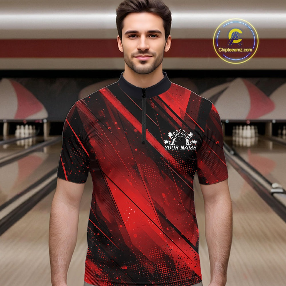 Man wearing a red and black bowling shirt with a personalized logo in a bowling alley.