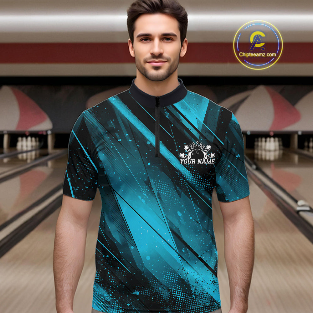 Man wearing a blue and black bowling shirt with a personalized design in a bowling alley.