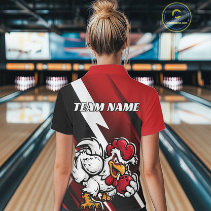 A woman viewed from behind wearing a custom bowling-themed polo shirt with a red, black, and white graphic design featuring a cartoon rooster and the text 'TEAM NAME'. The background shows blurred bowling alley lanes.