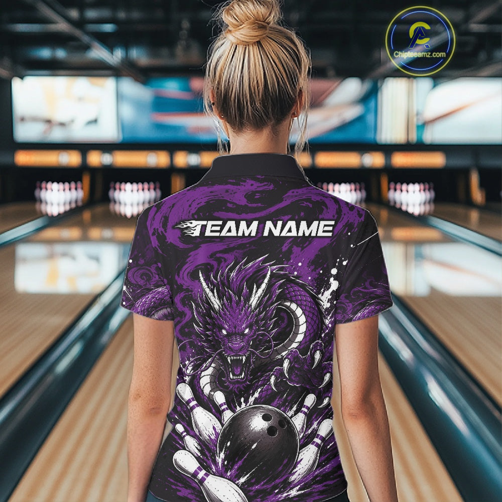 Person wearing a bowling shirt with a dragon design in a bowling alley
