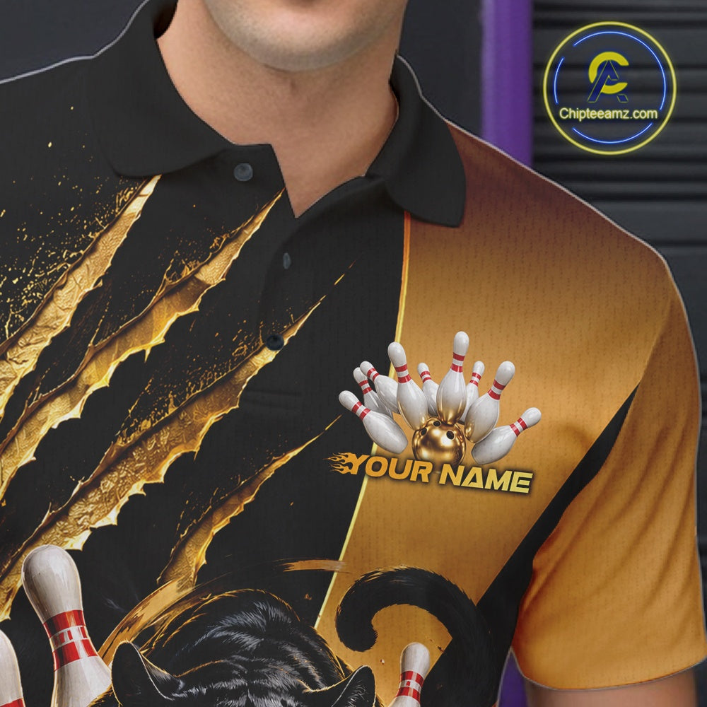 A close-up of a person wearing a custom bowling-themed polo shirt. The shirt features a black and gold design with a claw-mark graphic, bowling pins, a bowling ball, and the text 'YOUR NAME'.