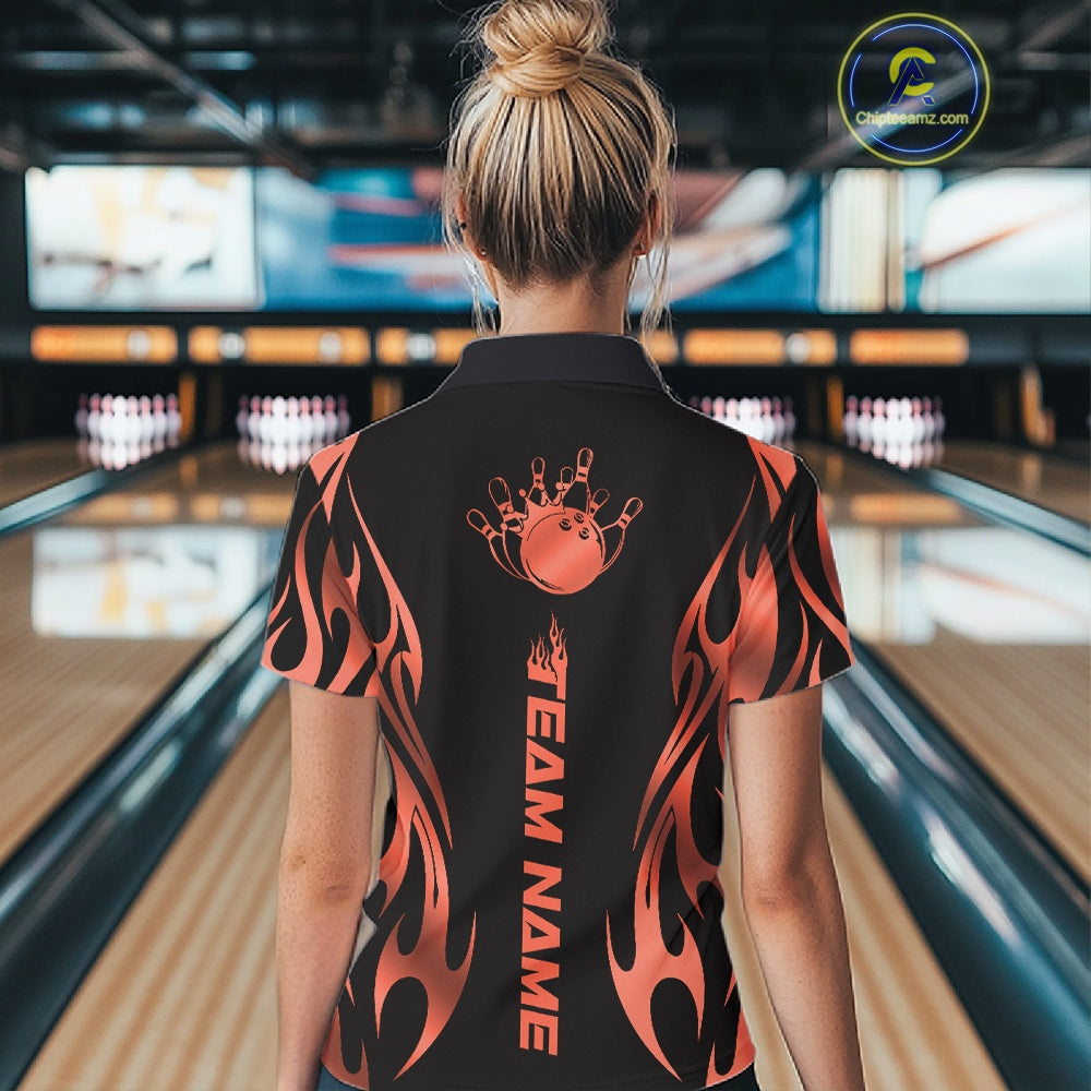 Female model back view in bowling lane wearing black polo shirt showcasing red gradient tribal flame bowling ball striking pins in vivid motion design.