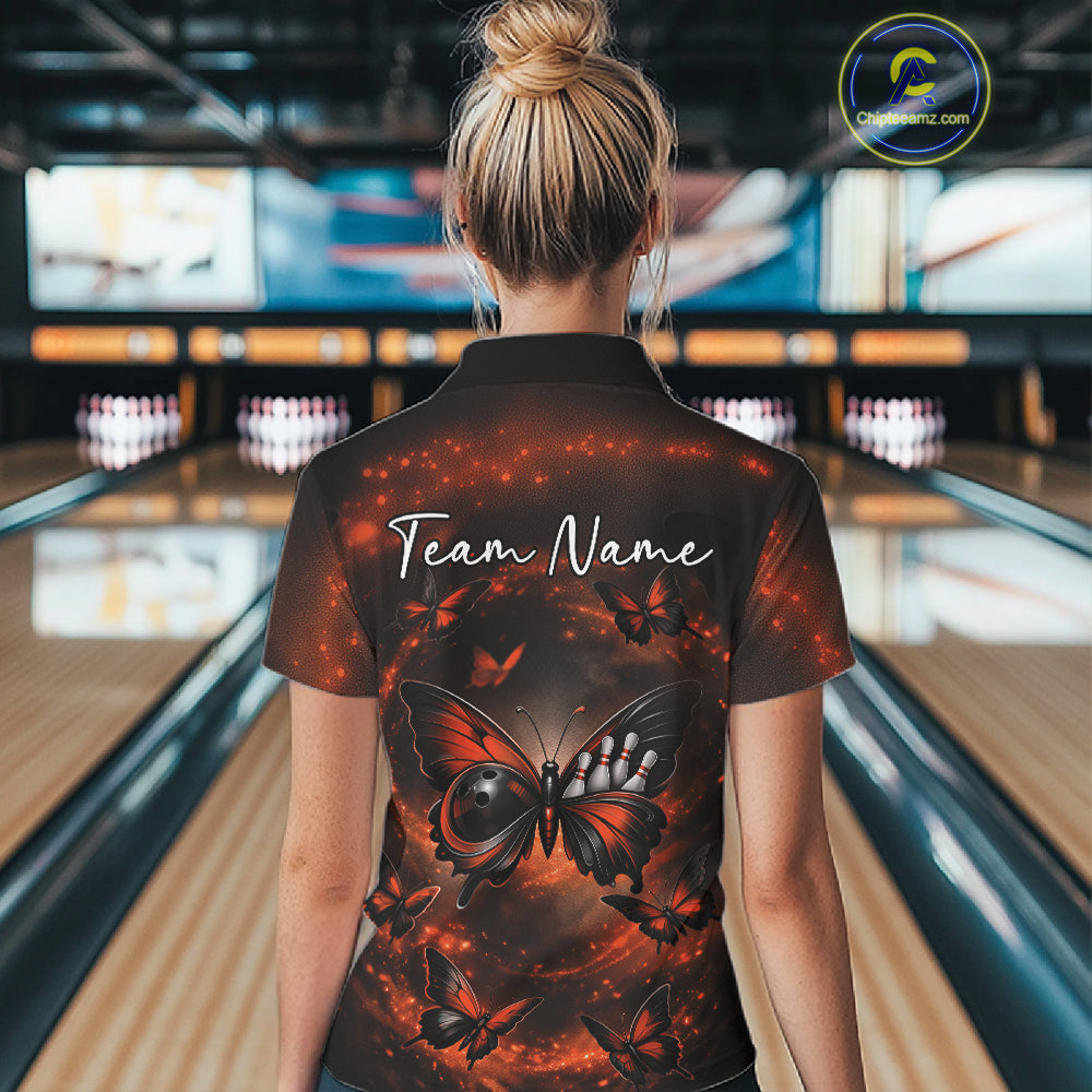 Back view of a female model in a bowling alley wearing a quarter-zip shirt showcasing an orange and black butterfly artwork with a bowling ball body and smoke effects.