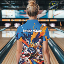 Load image into Gallery viewer, Back view of a female model wearing a bowling quarter zip shirt featuring a crowned cartoon bowling ball holding a royal scepter with animated bowling pins and colorful paint splashes in a bowling lane.