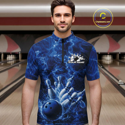 Male model wearing a bowling quarter-zip in a bowling alley with blue bowling ball artwork and dramatic flames.