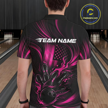 Back view of a male model in a bowling center wearing a black and pink polo featuring flaming bowling ball and pins design.