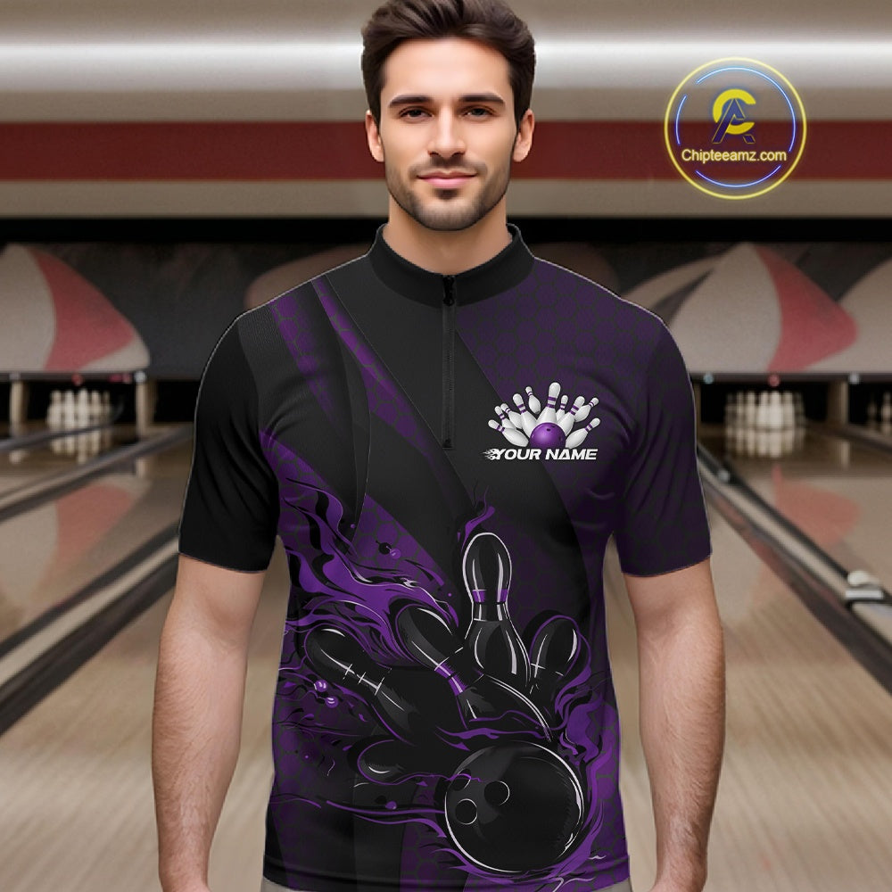 Male model wearing a black and purple bowling quarter-zip shirt at a bowling lane with fiery bowling action artwork, geometric patterns, and diagonal stripe accents.