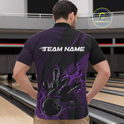 Male model at a bowling lane wearing a black and purple bowling quarter-zip shirt with a flaming bowling ball striking pins, hexagon graphics, and diagonal stripe accents.