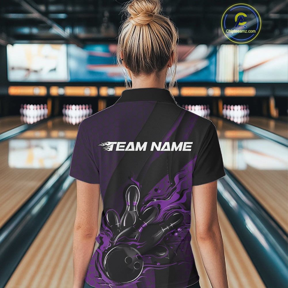 Female model at a bowling venue, back view of black and purple quarter zip shirt showing flames bowling ball hitting pins with hexagon and stripe design