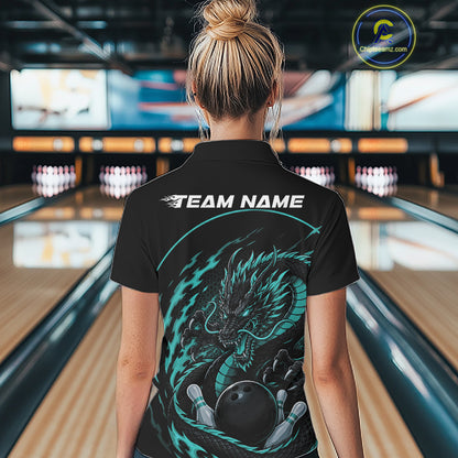 Back view of a female model in a bowling alley wearing a blue custom bowling polo shirt featuring an aggressive dragon with flames in a dynamic and energetic design.