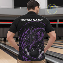 Load image into Gallery viewer, Back view of a male model in a bowling alley wearing a purple custom quarter-zip bowling shirt featuring an aggressive dragon with flames in a dynamic and energetic design.