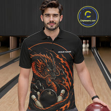 Load image into Gallery viewer, Front view of a male model in a bowling alley wearing an orange custom bowling polo shirt featuring an aggressive dragon with flames in a dynamic and energetic design.