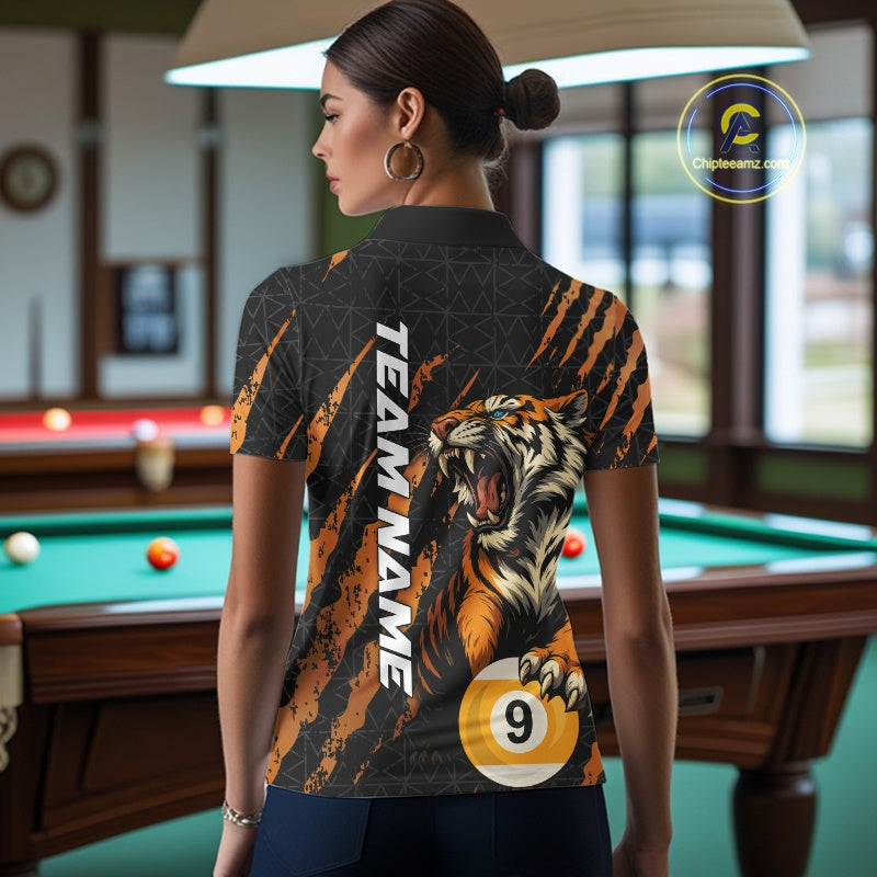 Back view of a female model wearing a polo shirt with roaring tiger artwork, orange claw marks, and billiard balls.